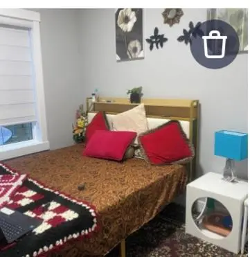 a bedroom with a bed with red pillows on it at Empress moment place #602 in Calgary
