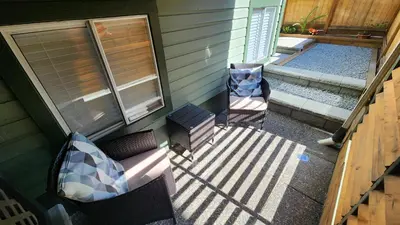 an aerial view of a porch with two chairs at The Bainbridge Studio in Burnaby