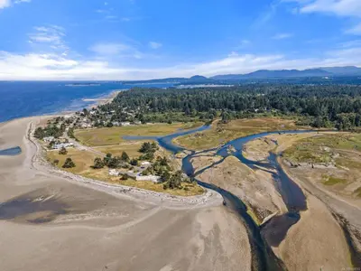 an aerial view of the shoreline of a beach at A Seaside Jacuzzi Escape in Parksville, BC, Canada in Parksville