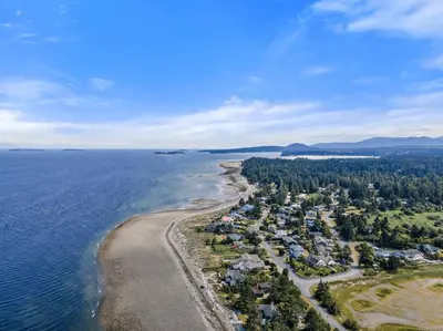 an aerial view of the shoreline of a beach at A Seaside Jacuzzi Escape in Parksville, BC, Canada in Parksville