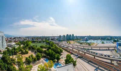 an overhead view of a city with a bridge and a river at Lovely condo with amazing view in Vancouver