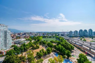 an aerial view of a city with buildings and trees at Lovely condo with amazing view in Vancouver