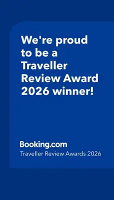 a blue sign that says were proud to be a traveler reviewagency winner at Entire guest suite in Cochrane, AB in Cochrane