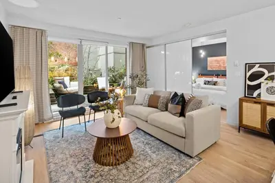 a living room with a couch and a table at Your Own Private Oasis In Victoria in Victoria