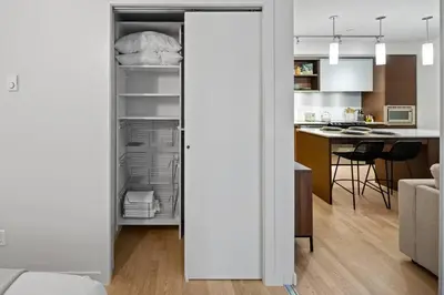a kitchen and living room with an open refrigerator at Your Own Private Oasis In Victoria in Victoria