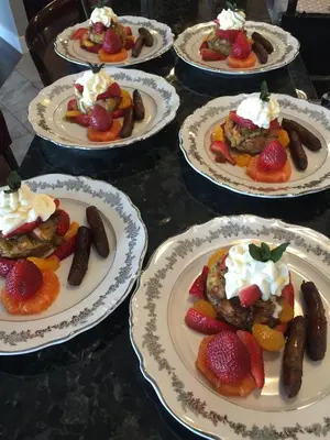 a group of plates of desserts on a table at Brookside Inn Boutique Hotel in Abbotsford