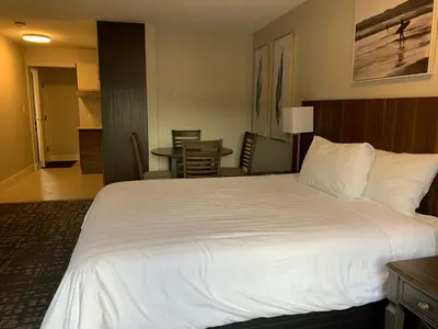 a large white bed in a hotel room at High Pont Resort in Quathiaski Cove