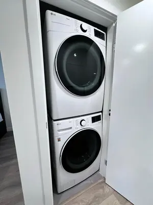 a washer and dryer in a room at New condo near Lougheed Mall & SFU in Coquitlam