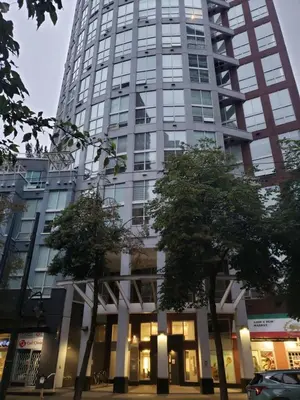 a tall building with trees in front of it at New York Style Loft in Downtown Vancouver-Ideal for World Cup 2026, Sleeps 4 in Vancouver