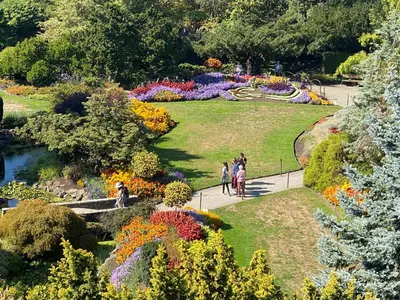 a group of people walking through a garden at 7 Bedrooms in the Heart of Vancouver in Vancouver