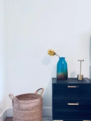 a blue vase sitting on top of a blue dresser at Modern King Room Private Ensuite Vancouver West in Vancouver