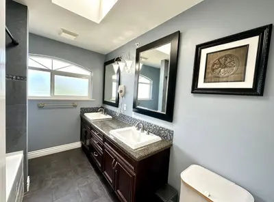 a bathroom with a sink and a mirror at Spacious 5BR 3BA Guest Villa - 10 Min to DT - Pet Friendly, Free Parking in Vancouver
