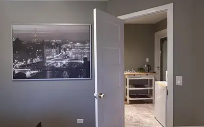 a room with a picture of a city on the wall at Airport-YVR GuestHouse in Richmond