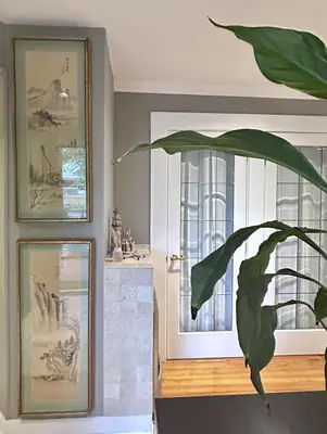 a plant in a room next to a door at Airport-YVR GuestHouse in Richmond