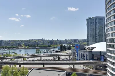 a view of a city with a river and buildings at Luxary Condo Downtown Vancouver with free parking in Vancouver