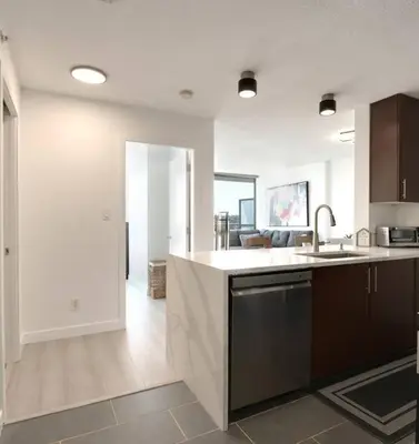 a kitchen with a sink and a counter top at Luxary Condo Downtown Vancouver with free parking in Vancouver