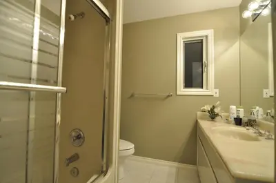 a bathroom with a toilet and a sink and a shower at Cornerstone Bed and Breakfast in Revelstoke