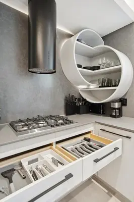a kitchen with white cabinets and a stove top oven at Designer 2BR in Downtown Steps from Sunset Beach in Vancouver