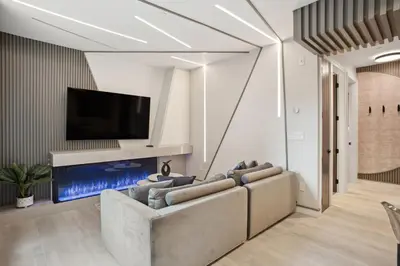 a living room with a couch and a flat screen tv at Designer 2BR in Downtown Steps from Sunset Beach in Vancouver