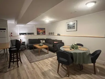 a living room with a couch and a table at Michaud's Basement unit in Nakusp