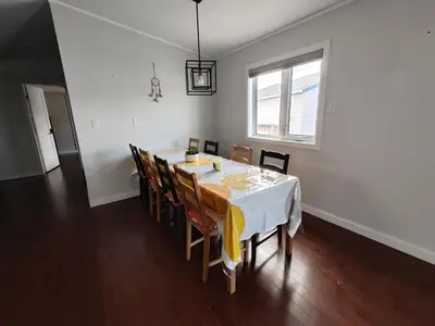 a dining room with a table and chairs at EC Lodging in Yellowknife