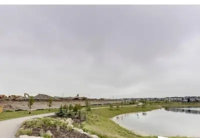 a road next to a body of water at Comfortable and centrally located guest suite in Calgary
