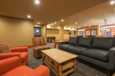 a living room with a couch and a table at Slalom Creek 3 Bedroom in Rossland