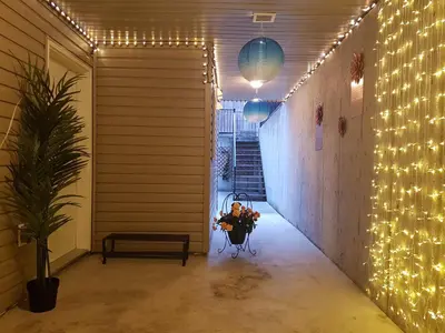 a hallway with christmas lights on the wall at Angela's Private Suites in Surrey