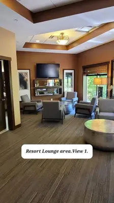a living room with a couch and chairs and a tv at ENTIRE Sunrise Resort Townhome in Parksville in Parksville