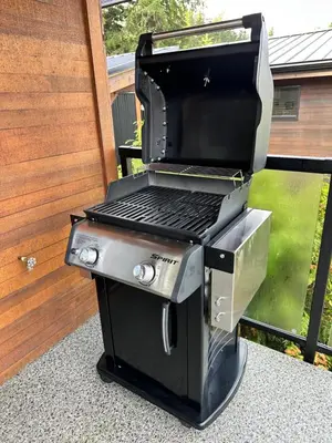a grill with a laptop on top of it at Eagle Way in Port Renfrew
