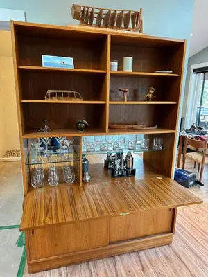 a wooden shelf with various items on it at Eagle Way in Port Renfrew