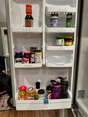 an open refrigerator filled with lots of food at Eagle Way in Port Renfrew