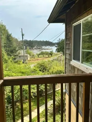 a balcony of a house with a view of a river at Silva Bay View BnB in Gabriola
