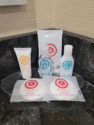 three bottles of sunscreen and other products on a table at The Kanata Bonnyville in Bonnyville