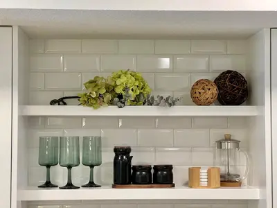 a shelf with glasses and other items on it at Special! New Downtown Mtn View Free Parking 2b&2b in Canmore
