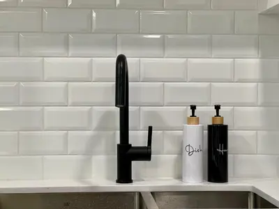 a kitchen counter with two bottles on a sink at Special! New Downtown Mtn View Free Parking 2b&2b in Canmore