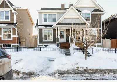 a house with snow in front of it at Basement Apartment in Calgary