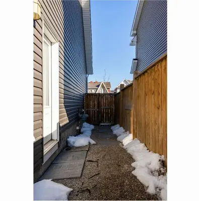 a row of snow on the side of a house at Basement Apartment in Calgary