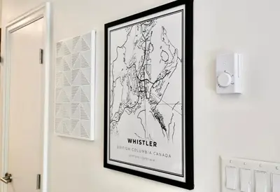 a picture of a map hanging on a wall at Whistler Village 2BR 2BA Top-Floor Condo with Hot Tub and Parking in Whistler