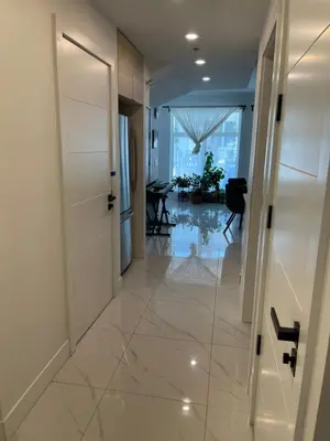 a hallway with a door and a room with a table at New Luxury Walkout Suite Near University-BY ROOM in Calgary