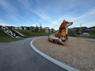 a small playground with a toy dog on the road at Chic & Cozy 2-BR Suite at Glacier Ridge NW Calgary in Calgary