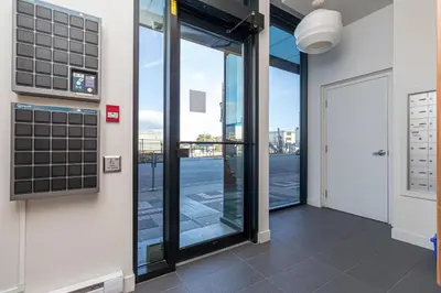 an office door with a view of a street at Chic And Cozy Condo In Old Town Victoria in Victoria