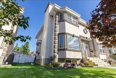 a large house with a grass yard at Spacious 3bedrm for family or business travellers in Red Deer