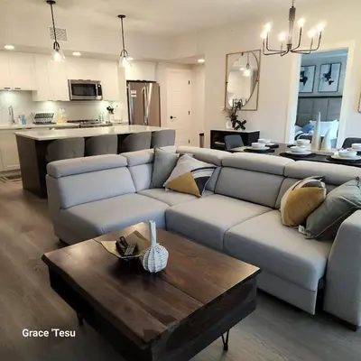 a living room with a couch and a table at Cozy Cove Retreat Escape to Tranquility Stay in Simplicity in Dead Man's Flats