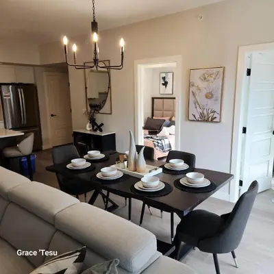 a living room with a table and a couch at Cozy Cove Retreat Escape to Tranquility Stay in Simplicity in Dead Man's Flats
