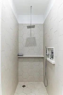 a bathroom with a shower and a sink at Modern industrial suite in Grand Forks in Grand Forks