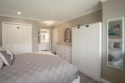 a bedroom with a bed and a dresser at 2BR in Nicklaus North Clubhouse, Lake and Mountain Views, Gas Fireplace, Parking in Whistler