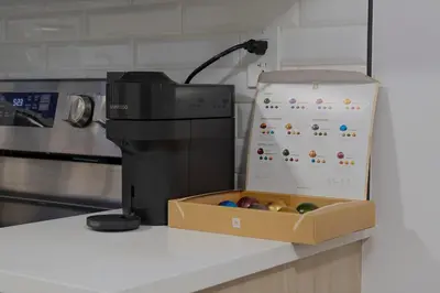 a box on a counter next to a printer at Modern Suite by Royal Alexandra Hospital l Free Parking WiFi Netflix in Edmonton