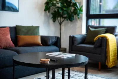 a living room with couches and a coffee table at Cedar and Loam by Revelstoke Vacations in Revelstoke
