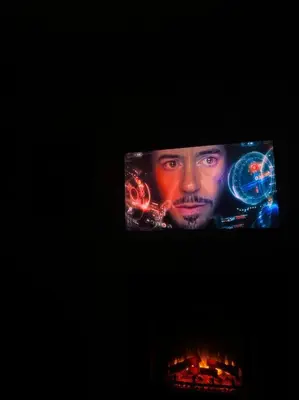 a television screen with a picture of a man at ZierHomes in Devon
